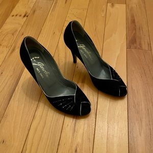 Black suede Garolini pump.